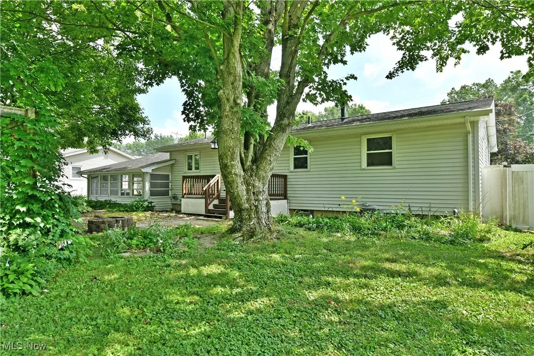Back of property with a wooden deck