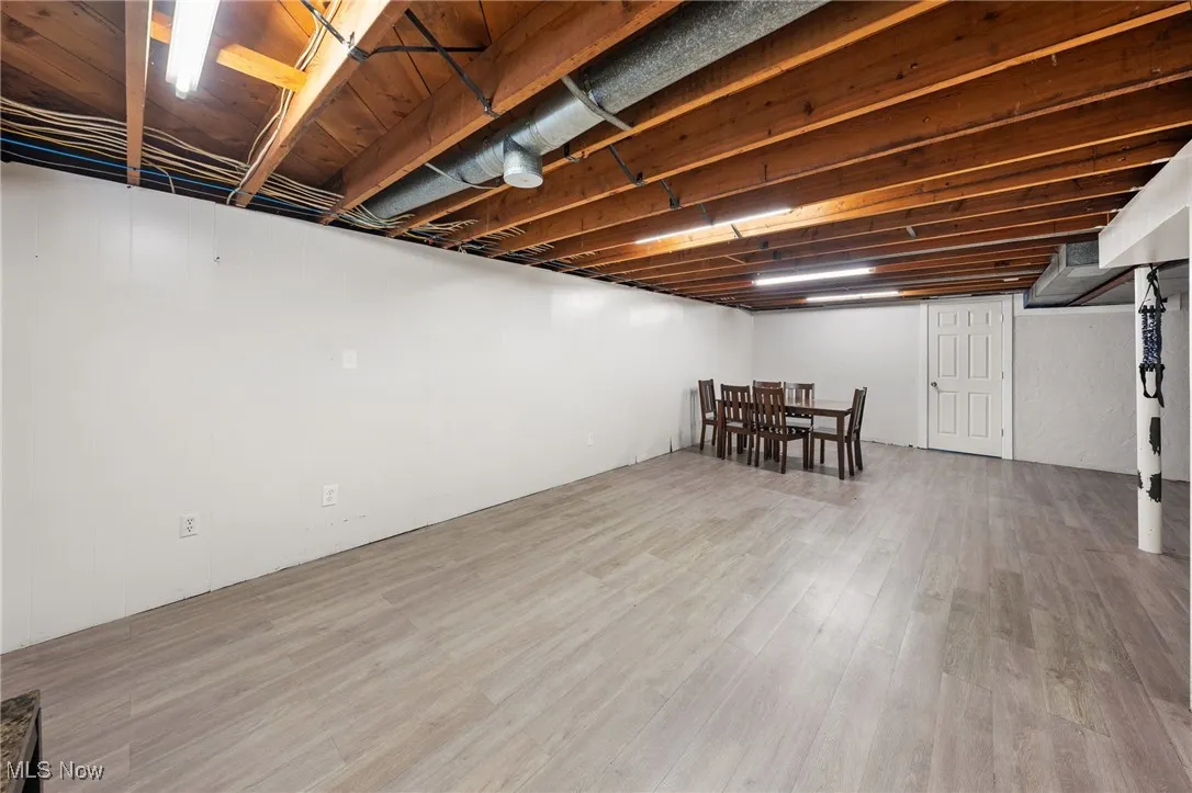 Finished below grade area featuring wood finished floors