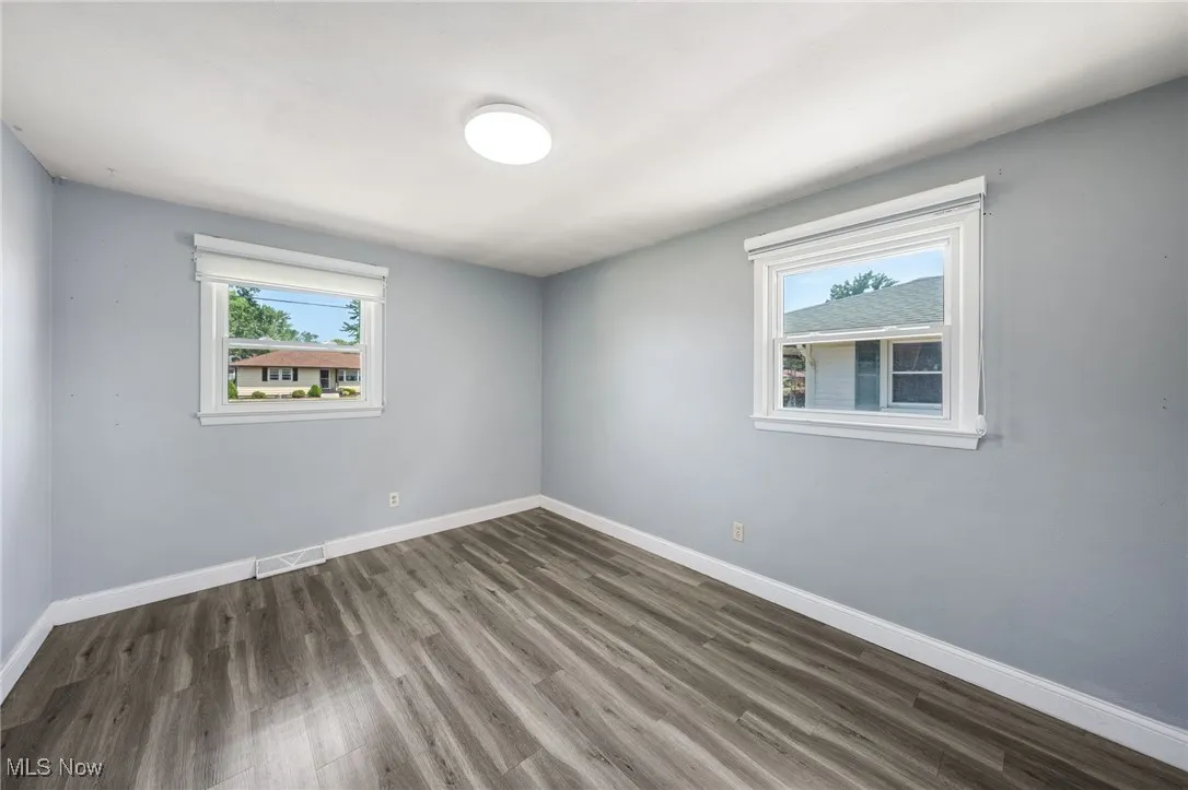 Unfurnished room with wood finished floors