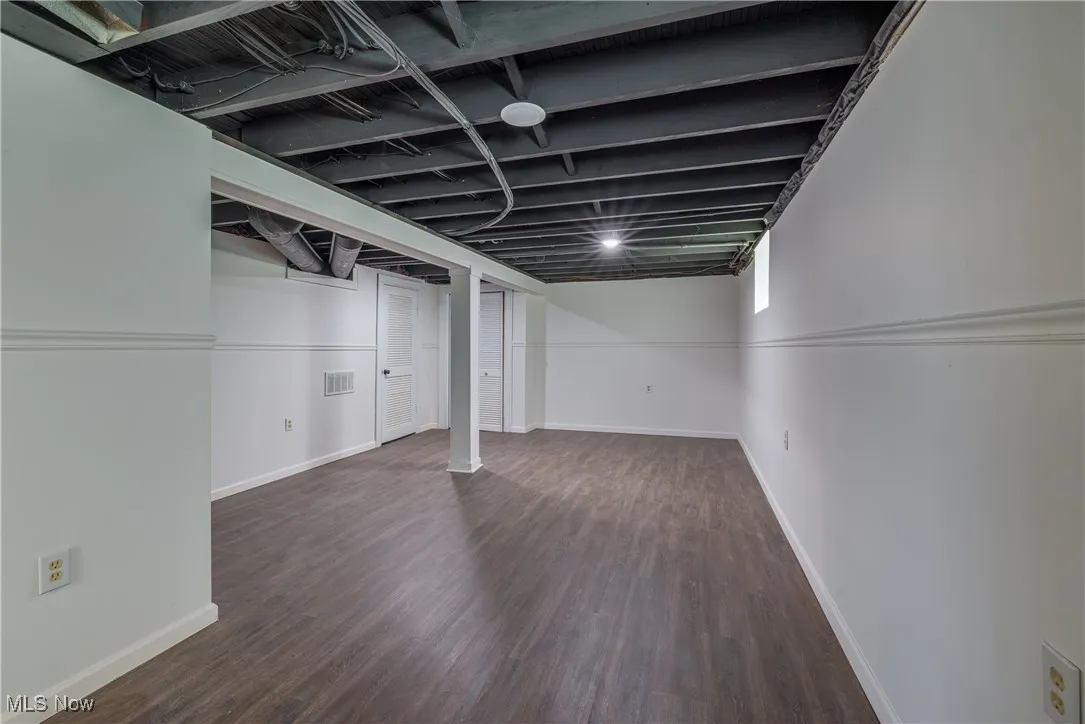 Below grade area with wood finished floors and baseboards