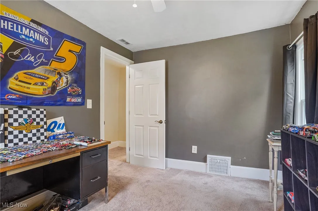 Office area with carpet and baseboards