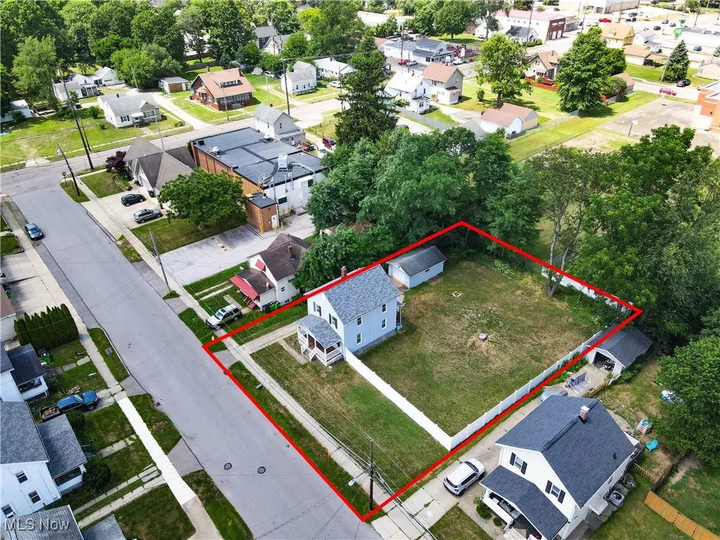 Aerial view of residential area with property parcel outlined