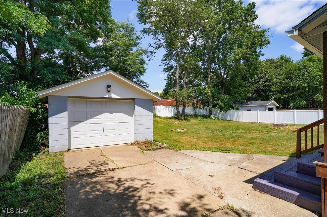 Detached garage with concrete driveway