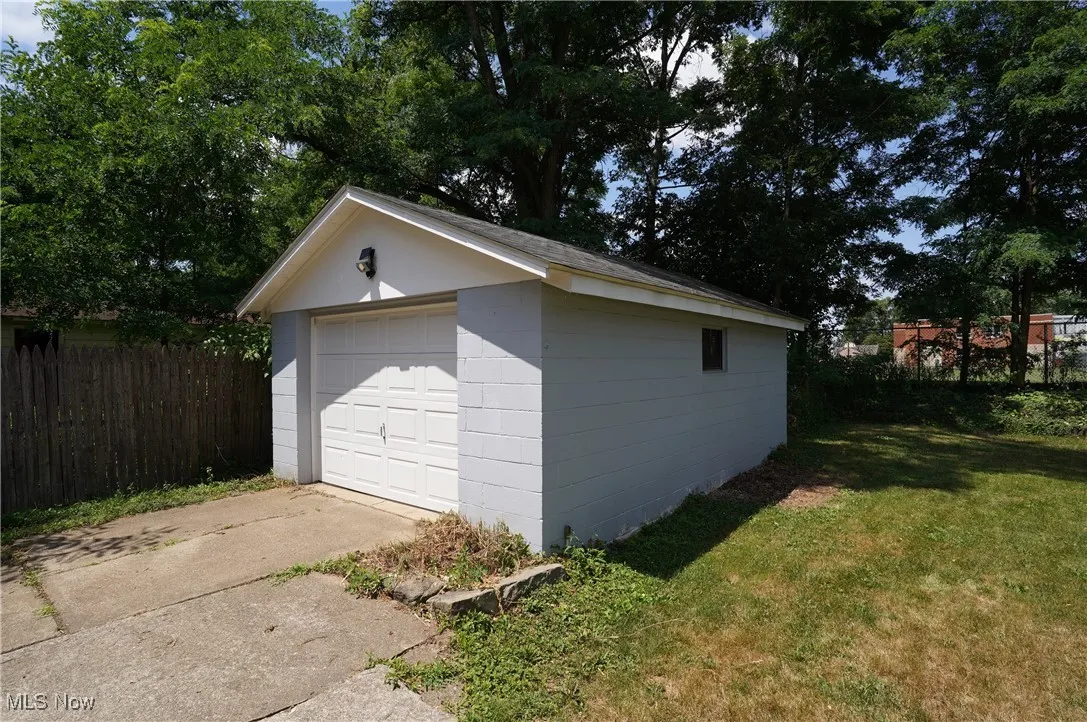Detached garage featuring driveway