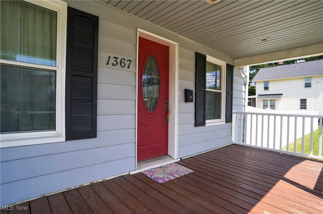 View of exterior entry with a porch