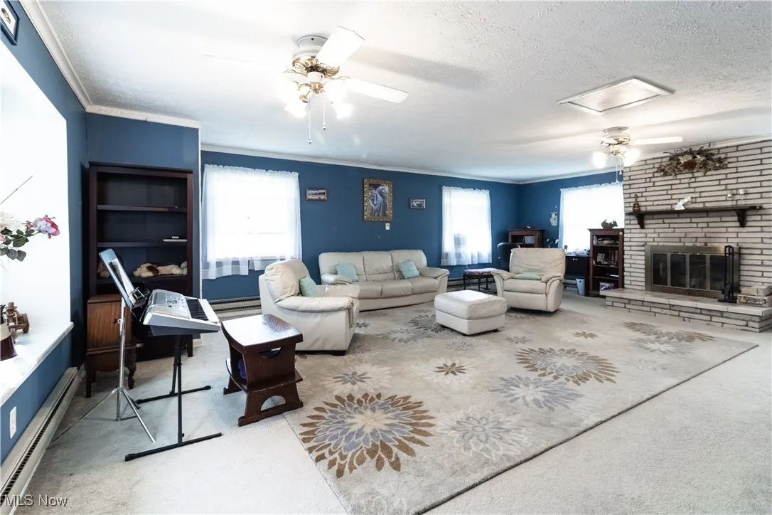 Upper level family room with wood burning fireplace