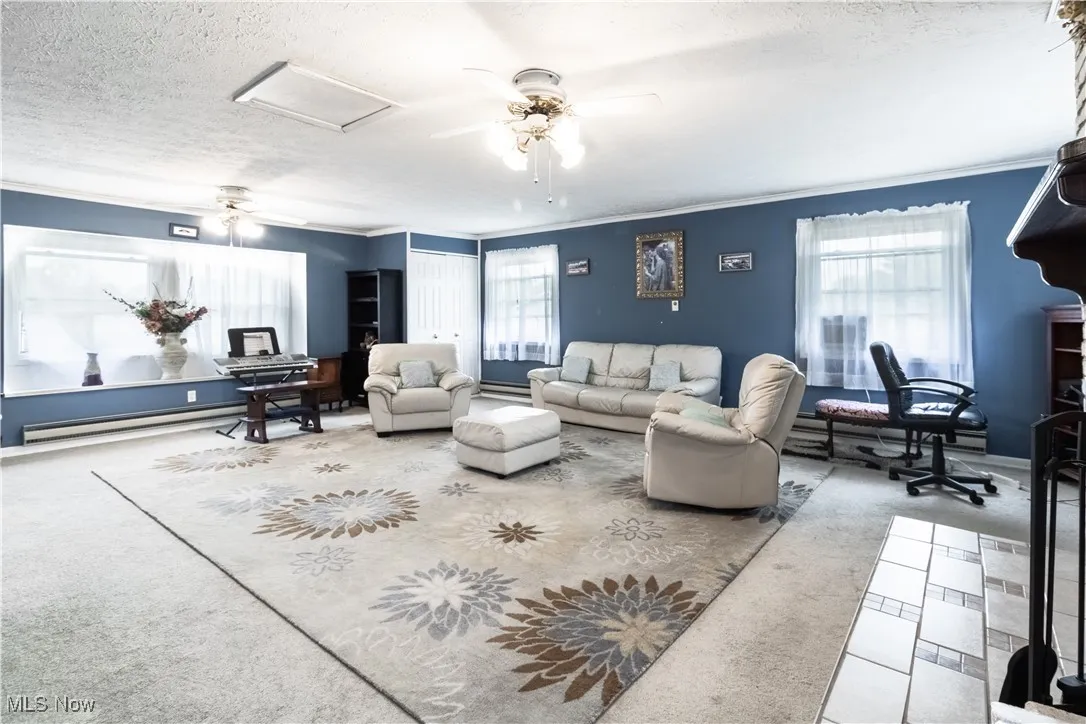 Upper level family room which features a fireplace