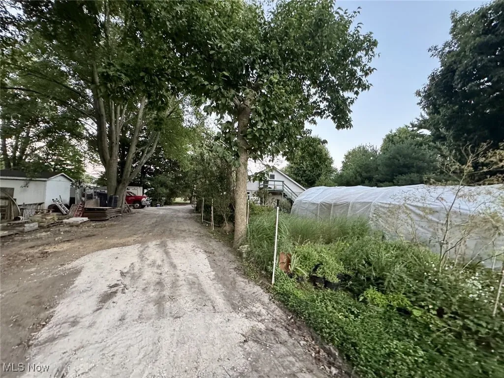 View of street featuring a greenhouse
