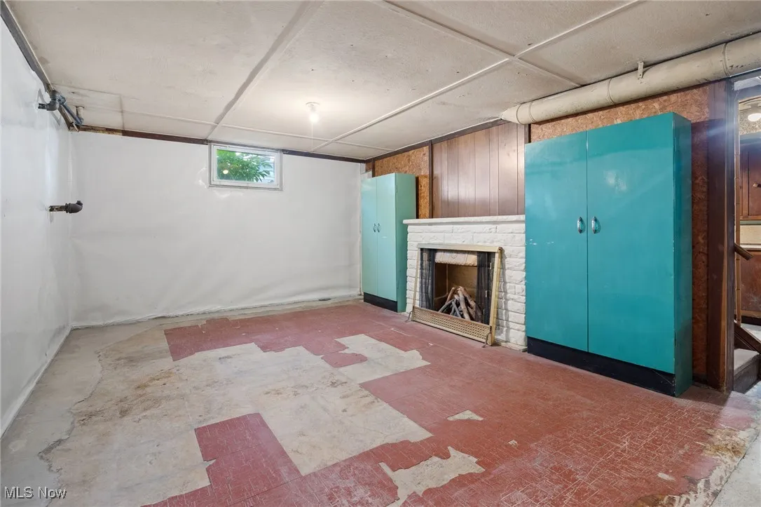 Below grade area featuring a fireplace