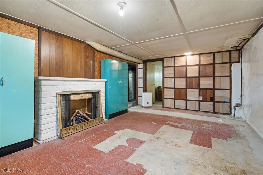 Below grade area featuring a brick fireplace