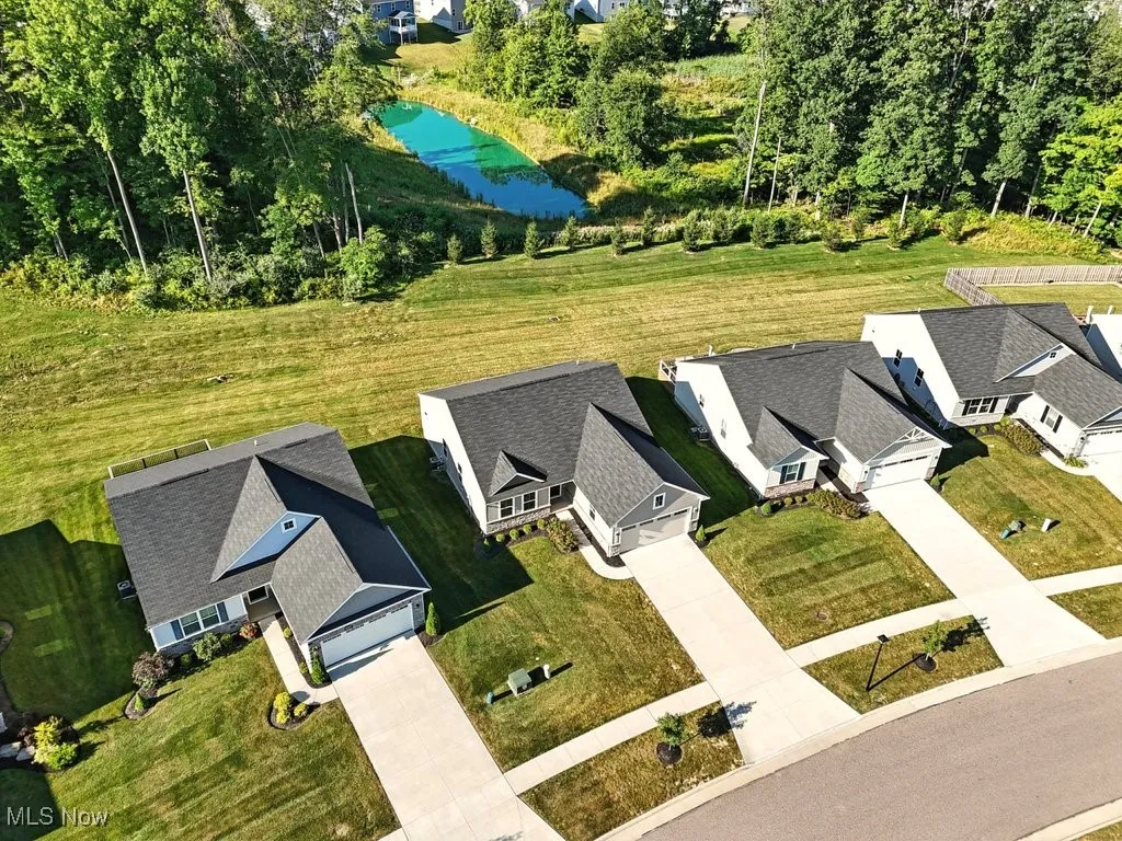 Aerial view of residential area featuring a large body of water