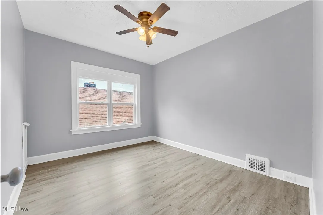 Spare room featuring ceiling fan and wood finished floors