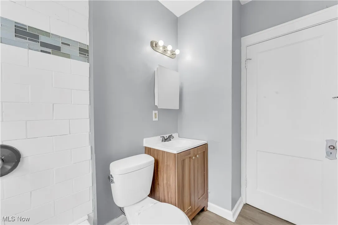 Bathroom featuring vanity and wood finished floors