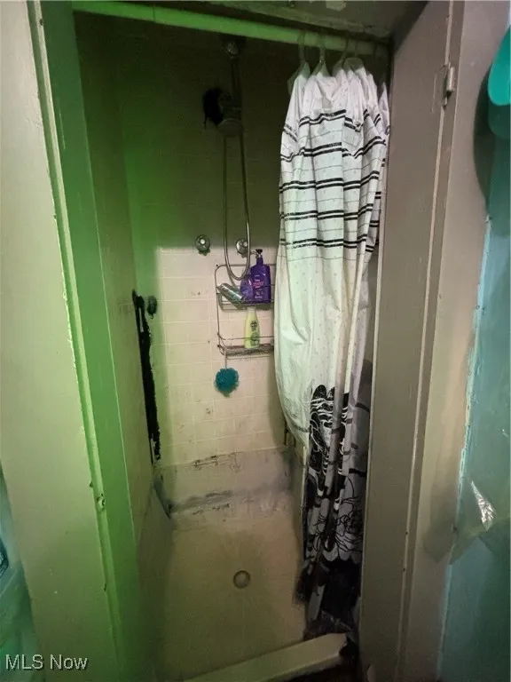 Full bath featuring a stall shower