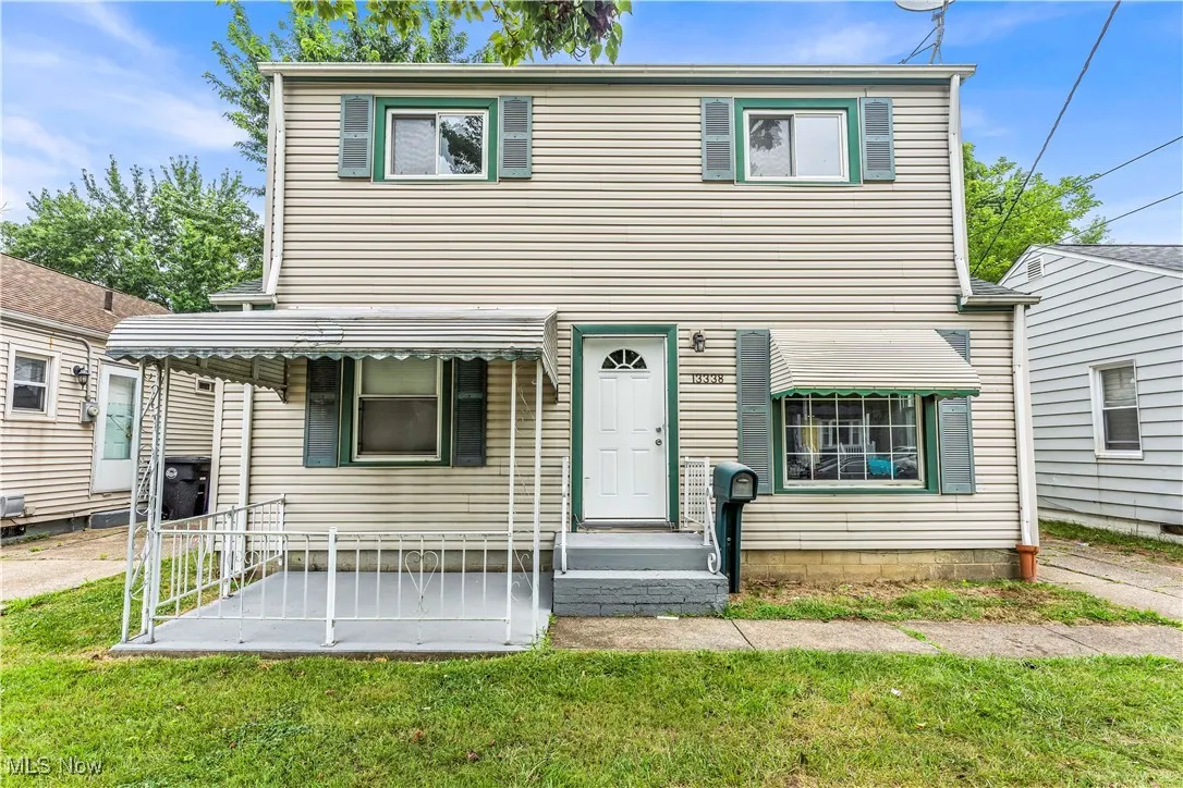 View of front of house with a front yard