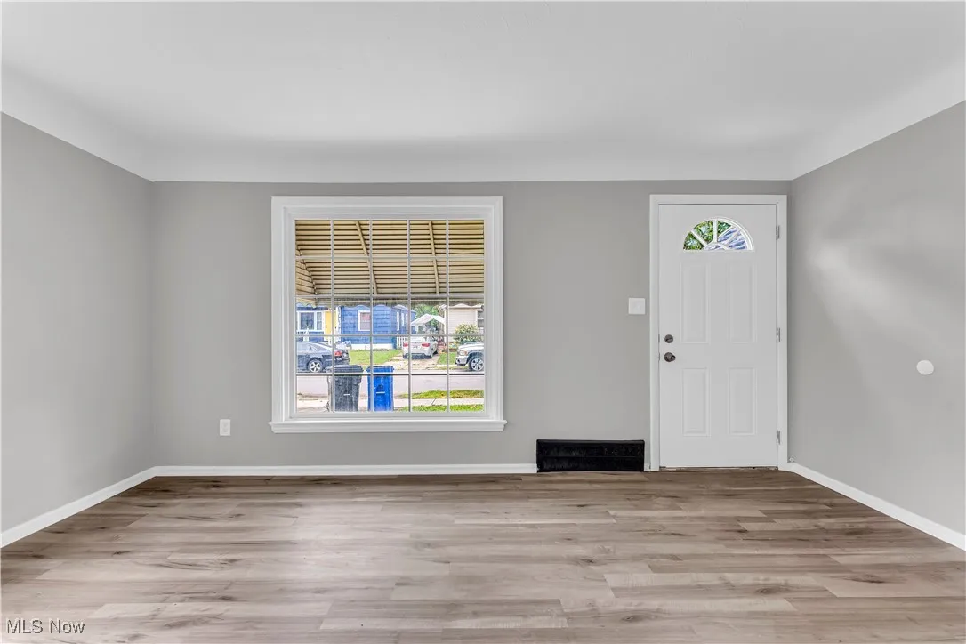 Entrance foyer featuring wood finished floors
