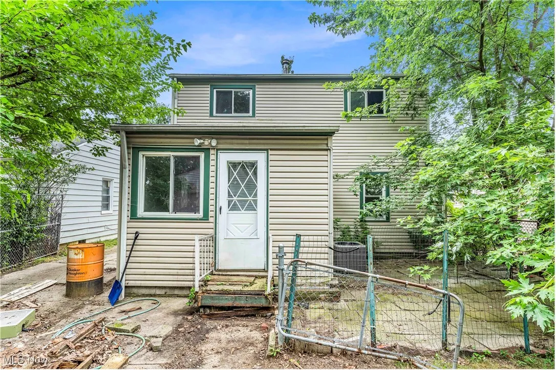 Rear view of property with entry steps
