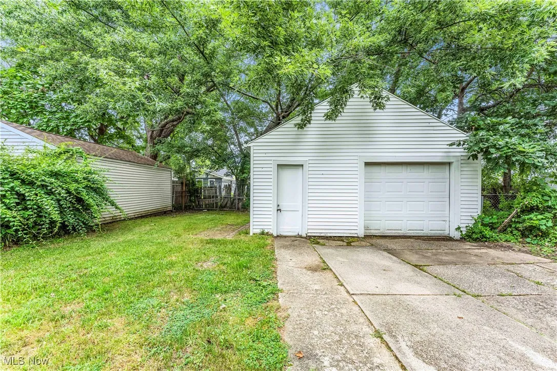 Detached garage featuring driveway