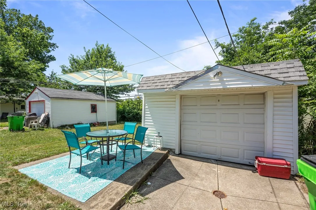 Detached garage with concrete driveway