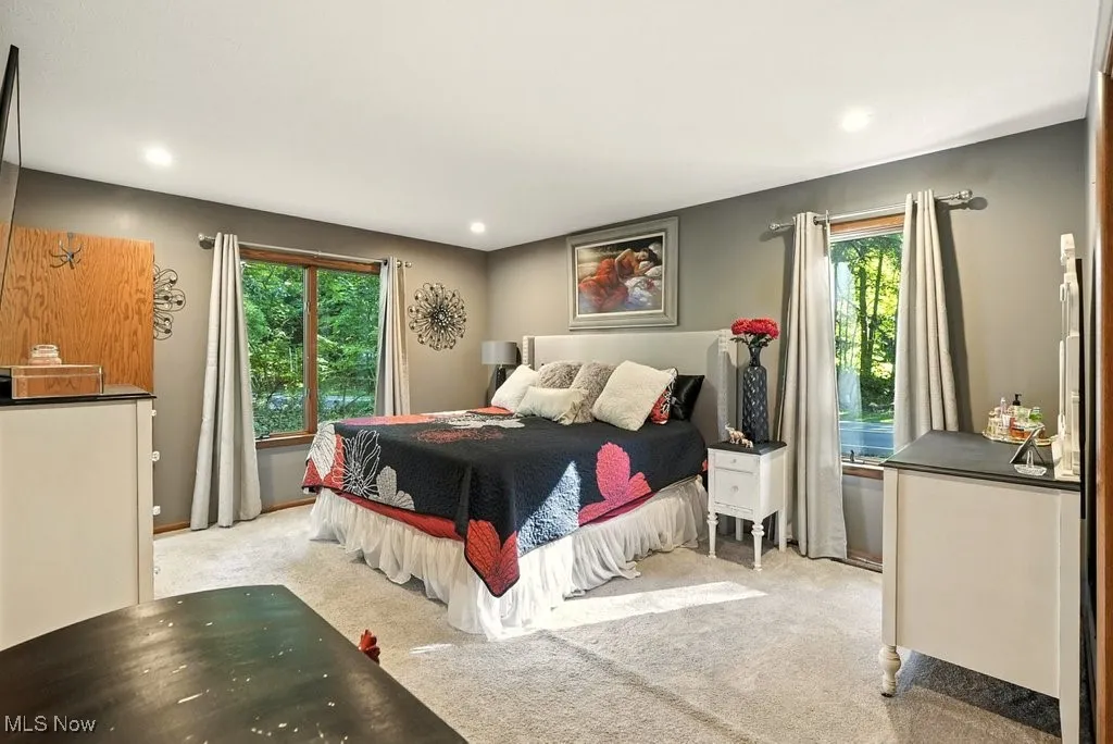 Bedroom featuring light colored carpet and recessed lighting