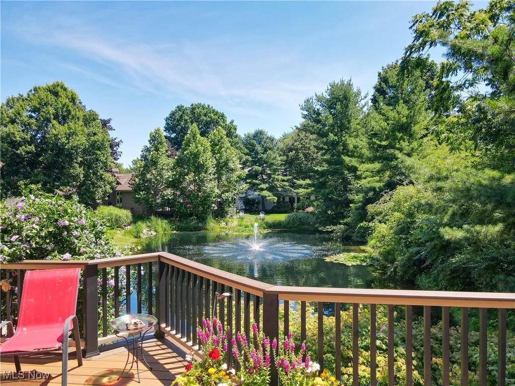 Wooden deck featuring a water view