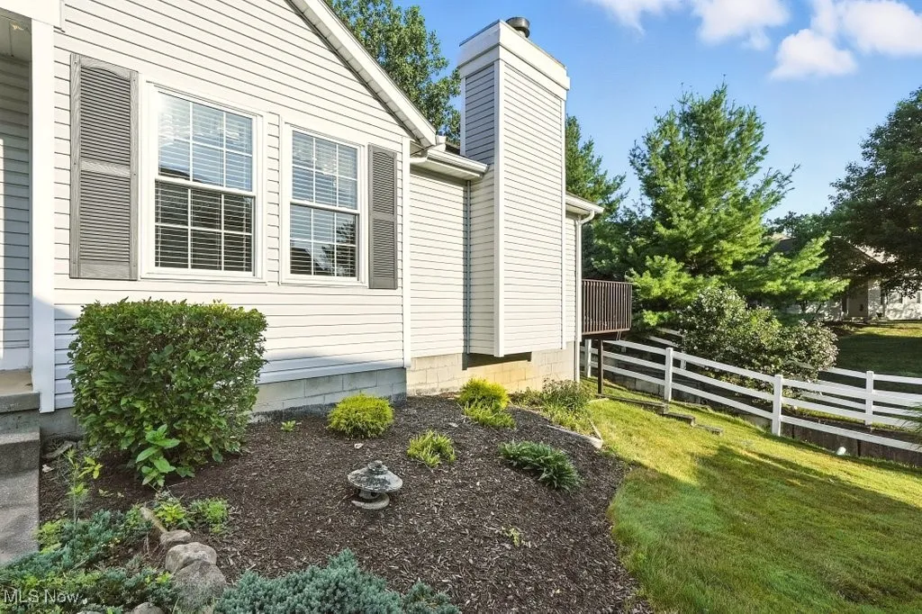 View of side of property featuring a chimney