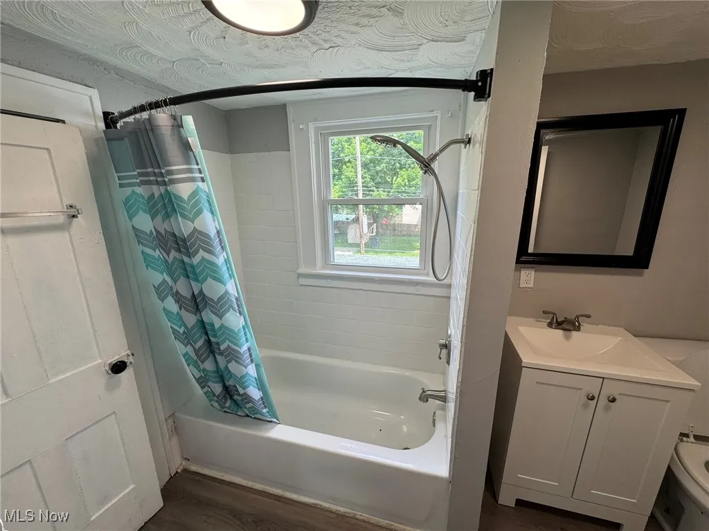 Second floor bathroom with shower / bath combo and vanity