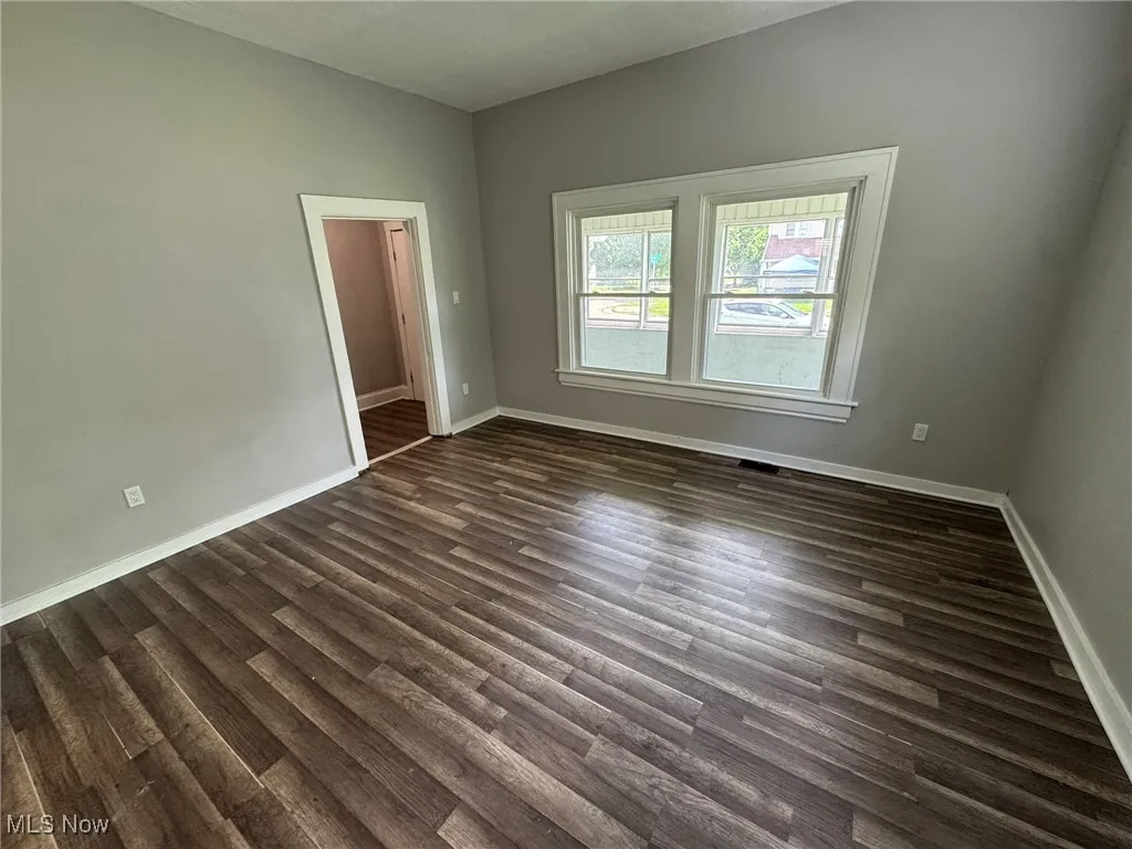 Large living room with dark wood LVP floors