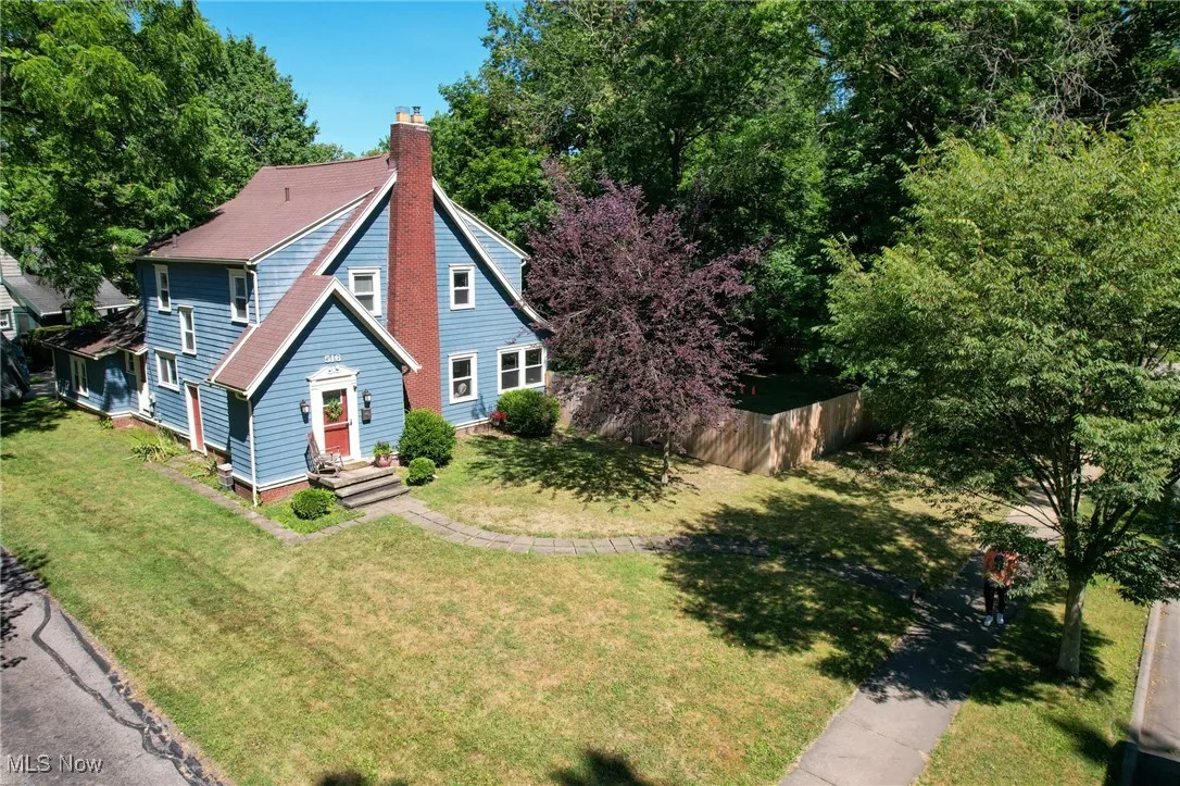 Bungalow-style house featuring a chimney