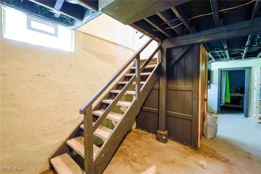 Below grade area featuring stairs