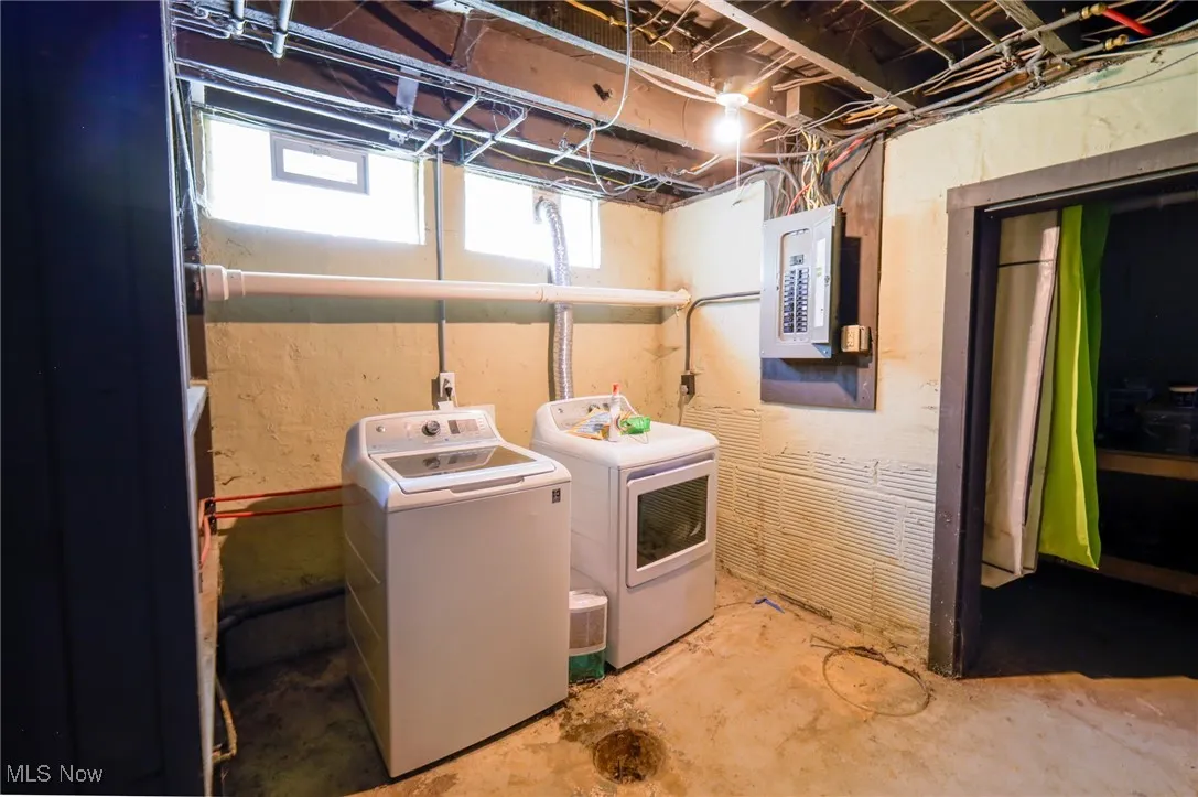 Washroom with separate washer and dryer and electric panel