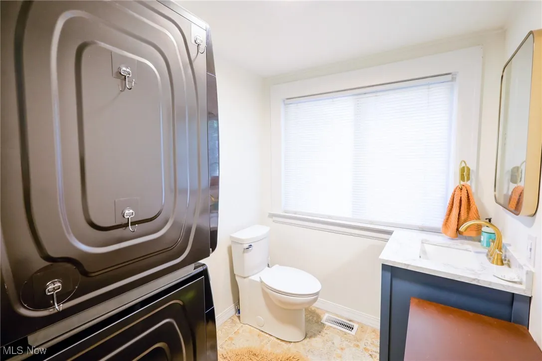 Bathroom with vanity and baseboards