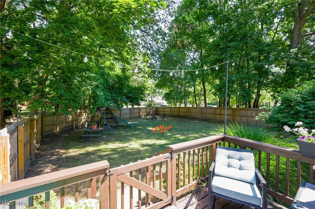 Deck with a fenced backyard