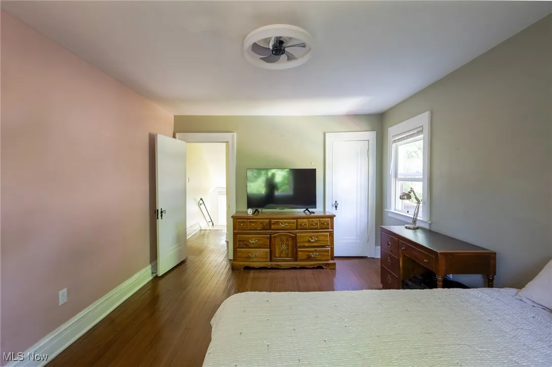 Bedroom with dark wood finished floors