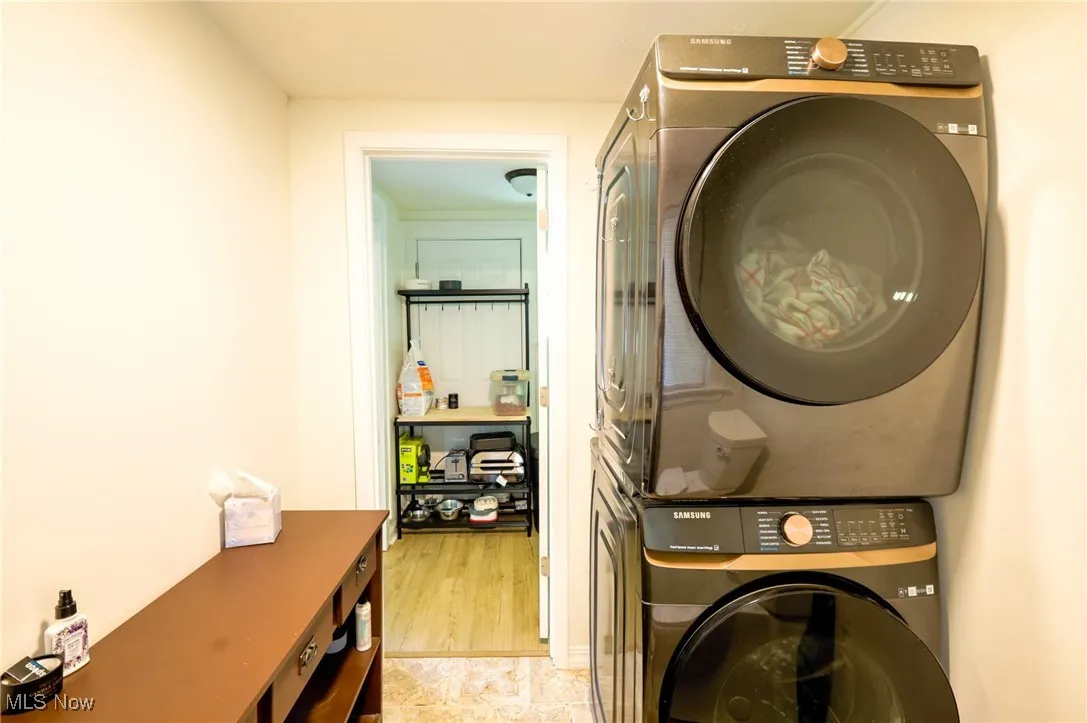 Laundry area with estacked washer and dryer