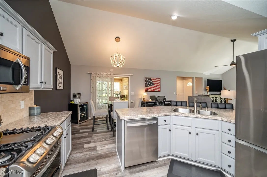 Kitchen cabinetry recently painted with special Benjamin Moore cabinetry paint. Stunning new countertop!