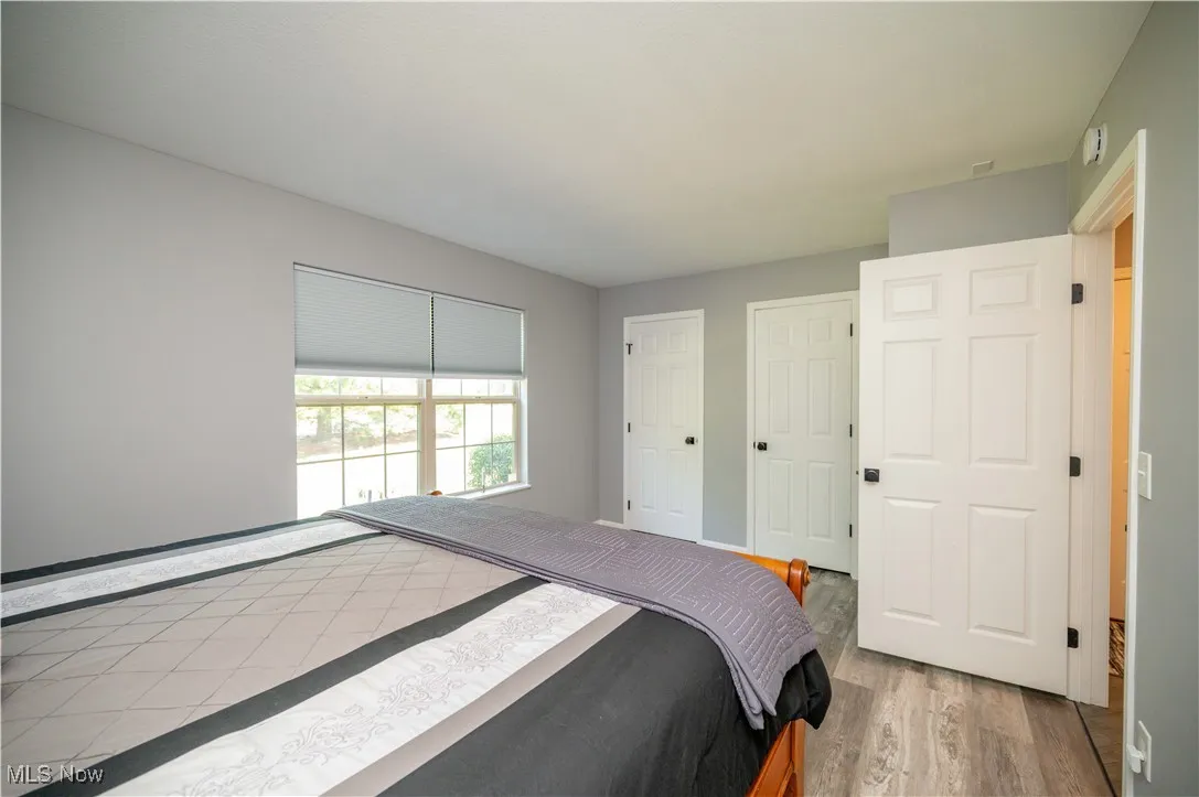 Secondary bedroom with multiple closets.