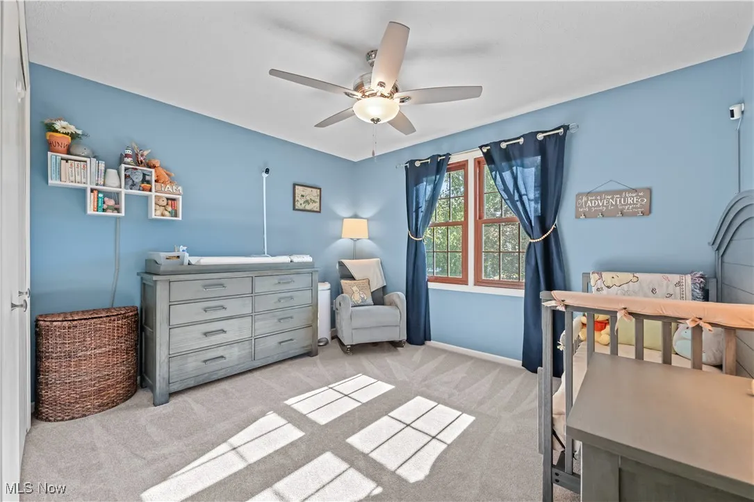 Bedroom with carpet floors and ceiling fan