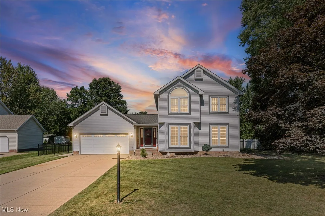 Traditional-style home with driveway and an attached garage