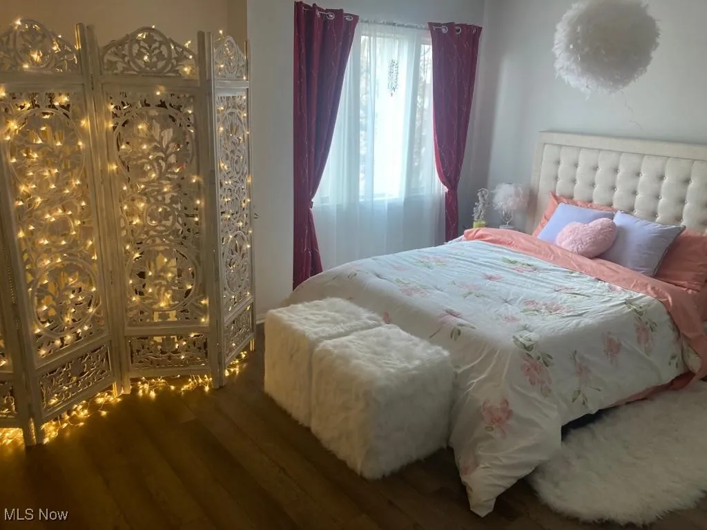 Bedroom featuring wood finished floors