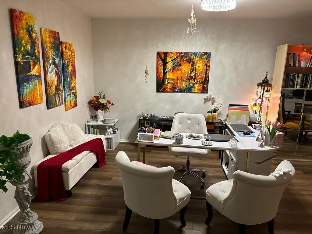 Office area with baseboards and wood finished floors