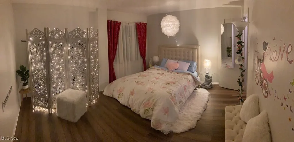 Bedroom featuring wood finished floors