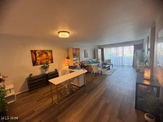 Dining room with dark wood-type flooring