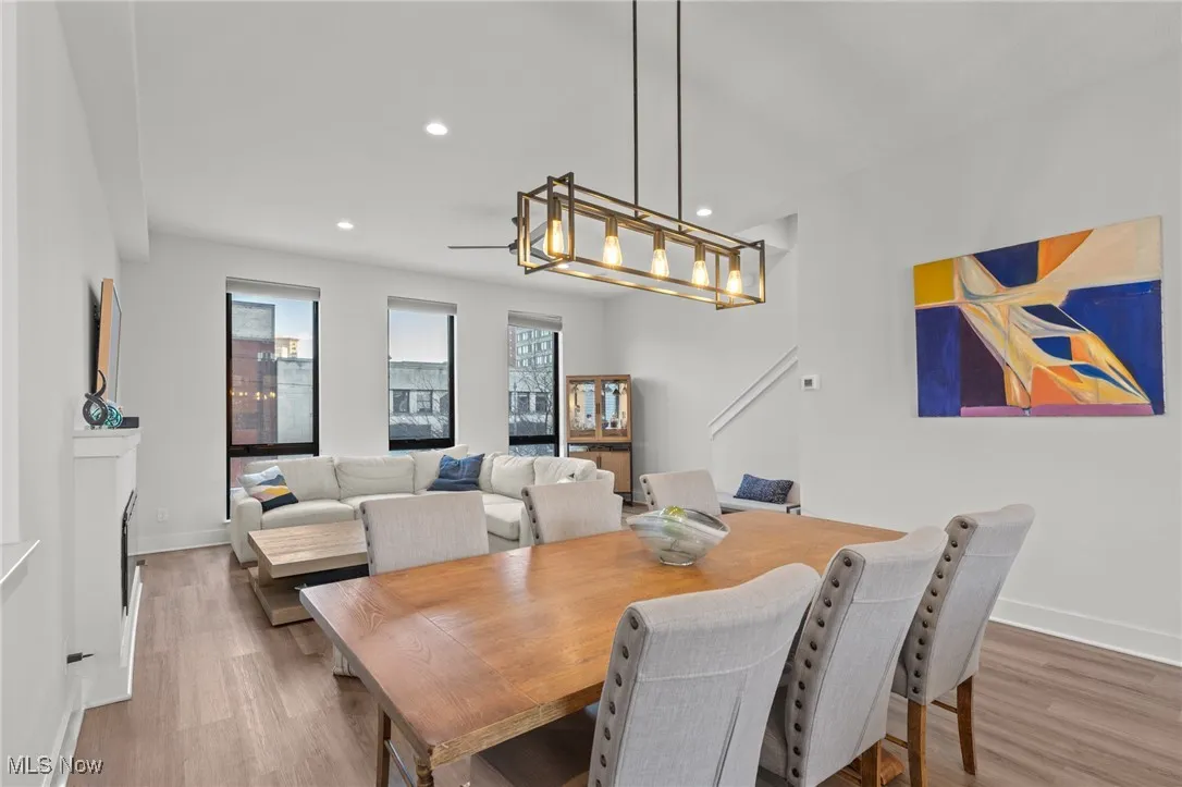 Dining area featuring wood finished floors and recessed lighting