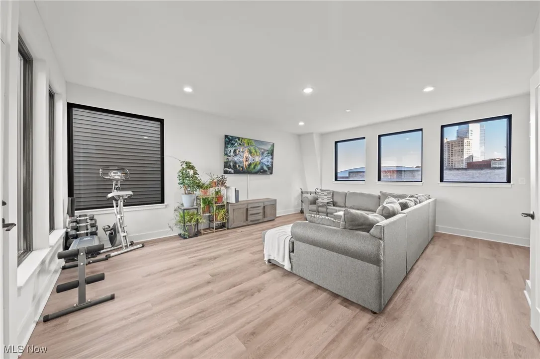 Living area featuring recessed lighting and light wood finished floors