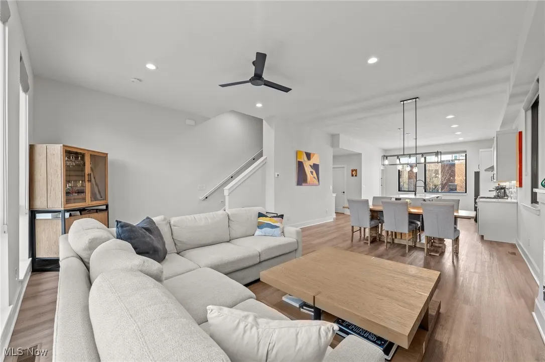 Living area featuring light wood-type flooring, recessed lighting, and ceiling fan