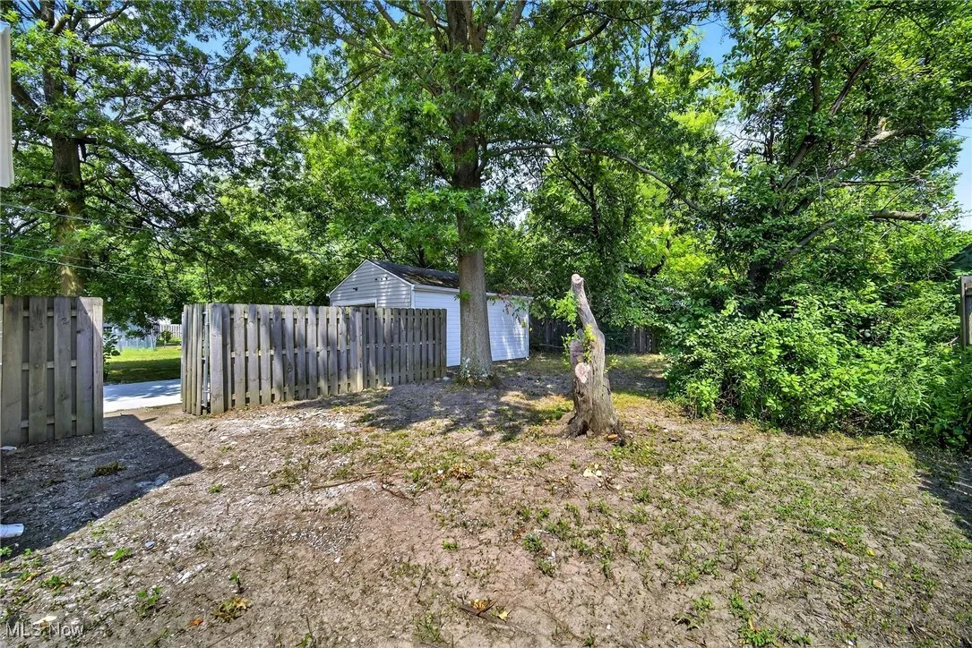 View of yard with a storage unit