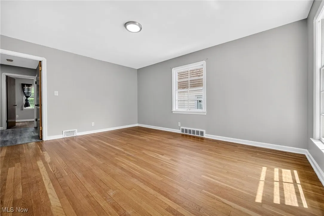 Empty room featuring hardwood / wood-style floors