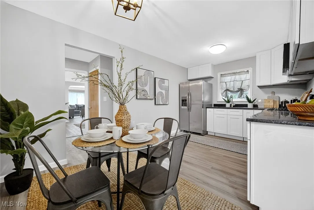 Dining space featuring light wood finished floors and plenty of natural light