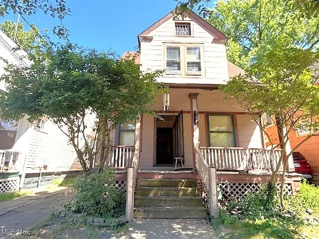 Victorian-style house with covered porch